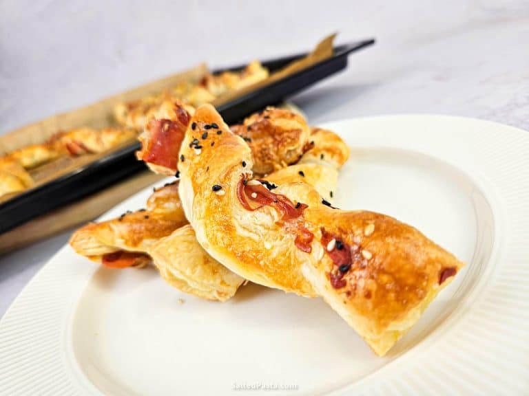Twisted puff pastry sticks with cheese and ham