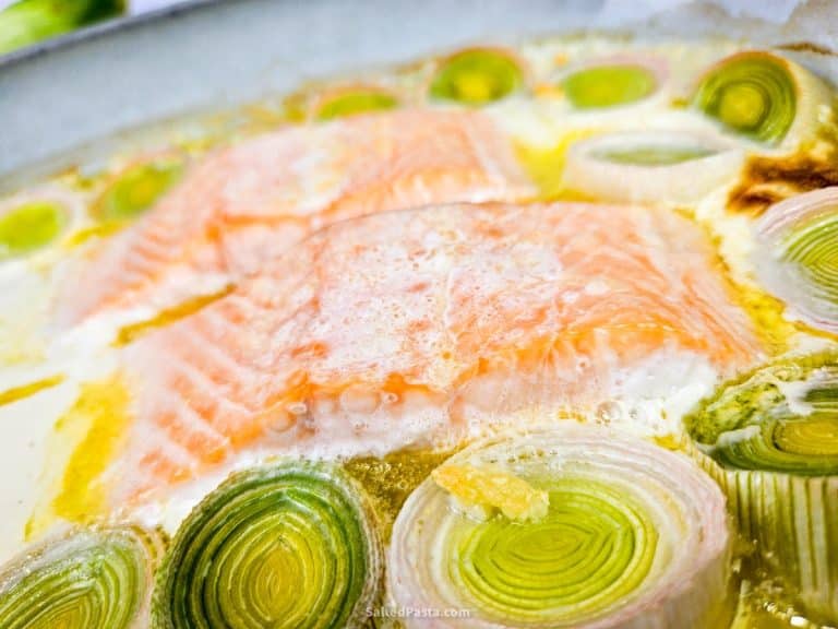 Oven-baked salmon with leeks in a dish