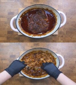 Pulling apart a roasted piece of pork shoulder
